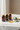 "Bone & Muscle Strength + Pack four supplement bottles on marble with eucalyptus and stone — Sacred Health structural strength and recovery"